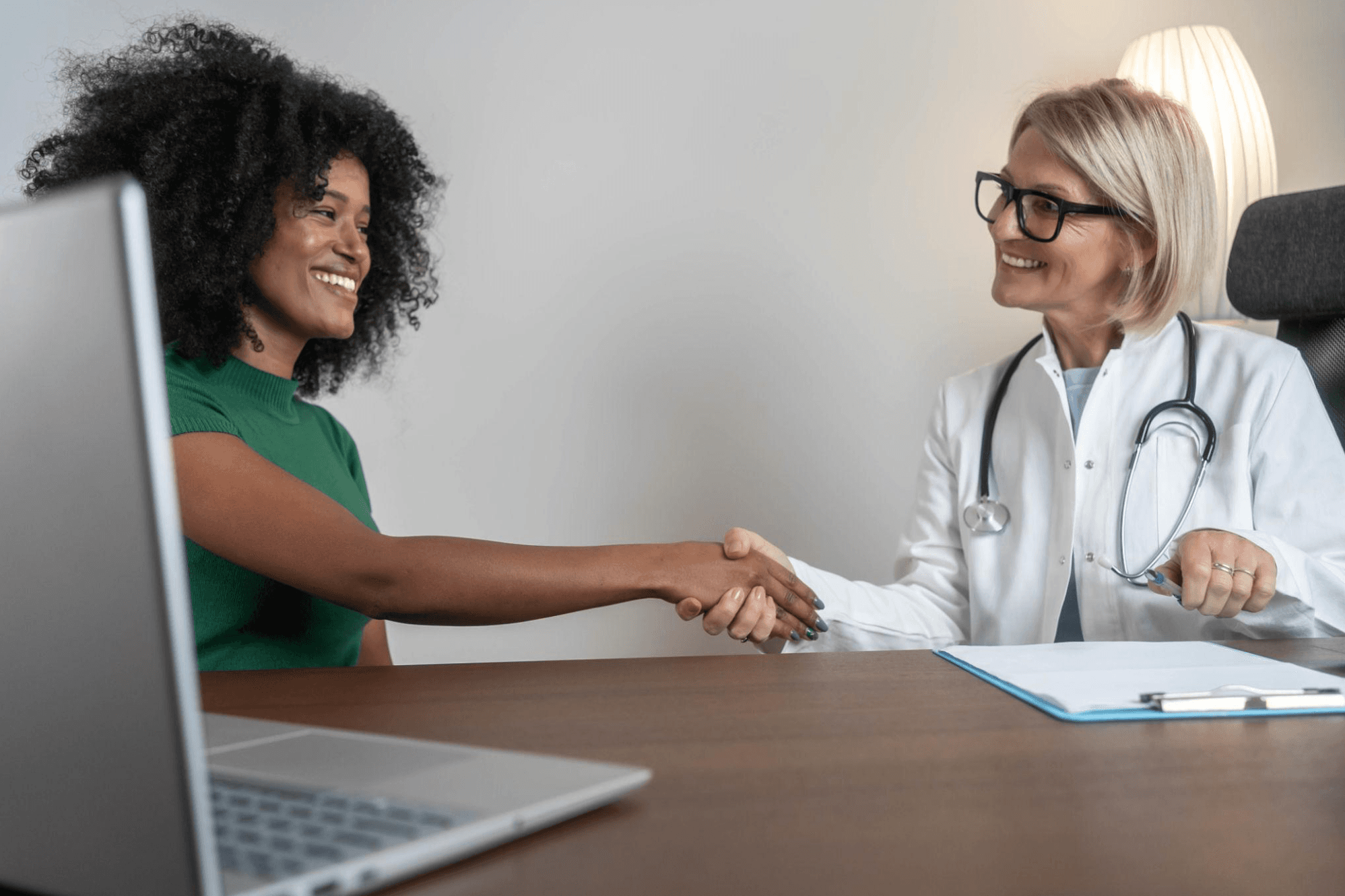 Doctor and patient shaking hands